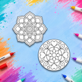 Two circular mandala art templates with black line art on a white background, arranged on a colorful paint-splattered blue surface with colored markers around the edges.